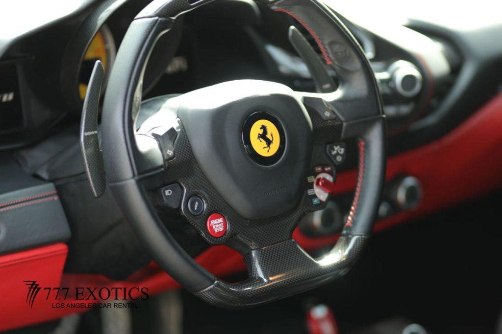 steering wheel of red ferrari 488