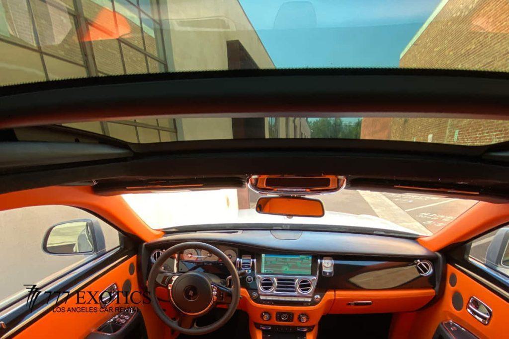 sun roof view of rolls royce ghost