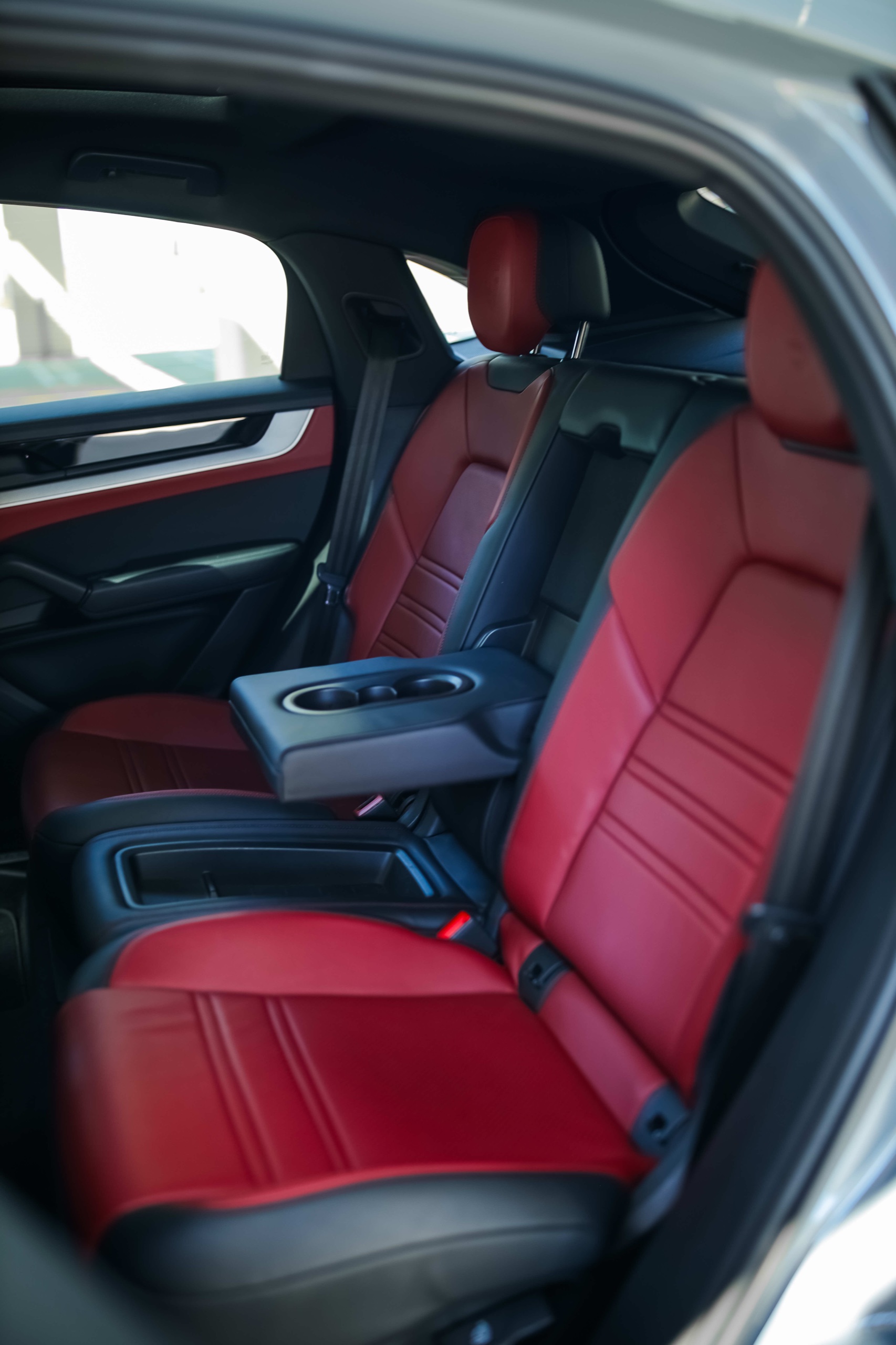 Two red leather rear seats in the Porsche Cayenne