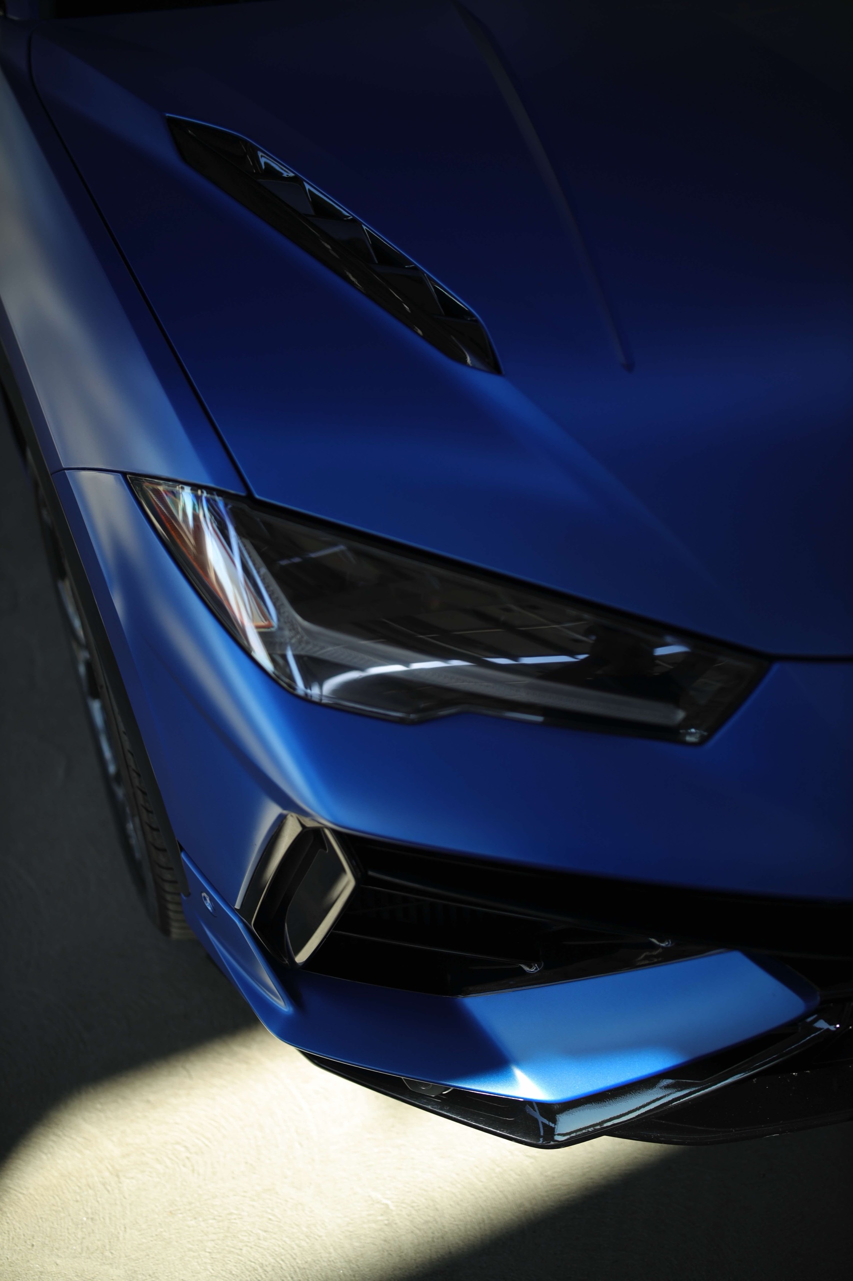 Lamborghini Urus S headlight and Frozen Blue front bumper