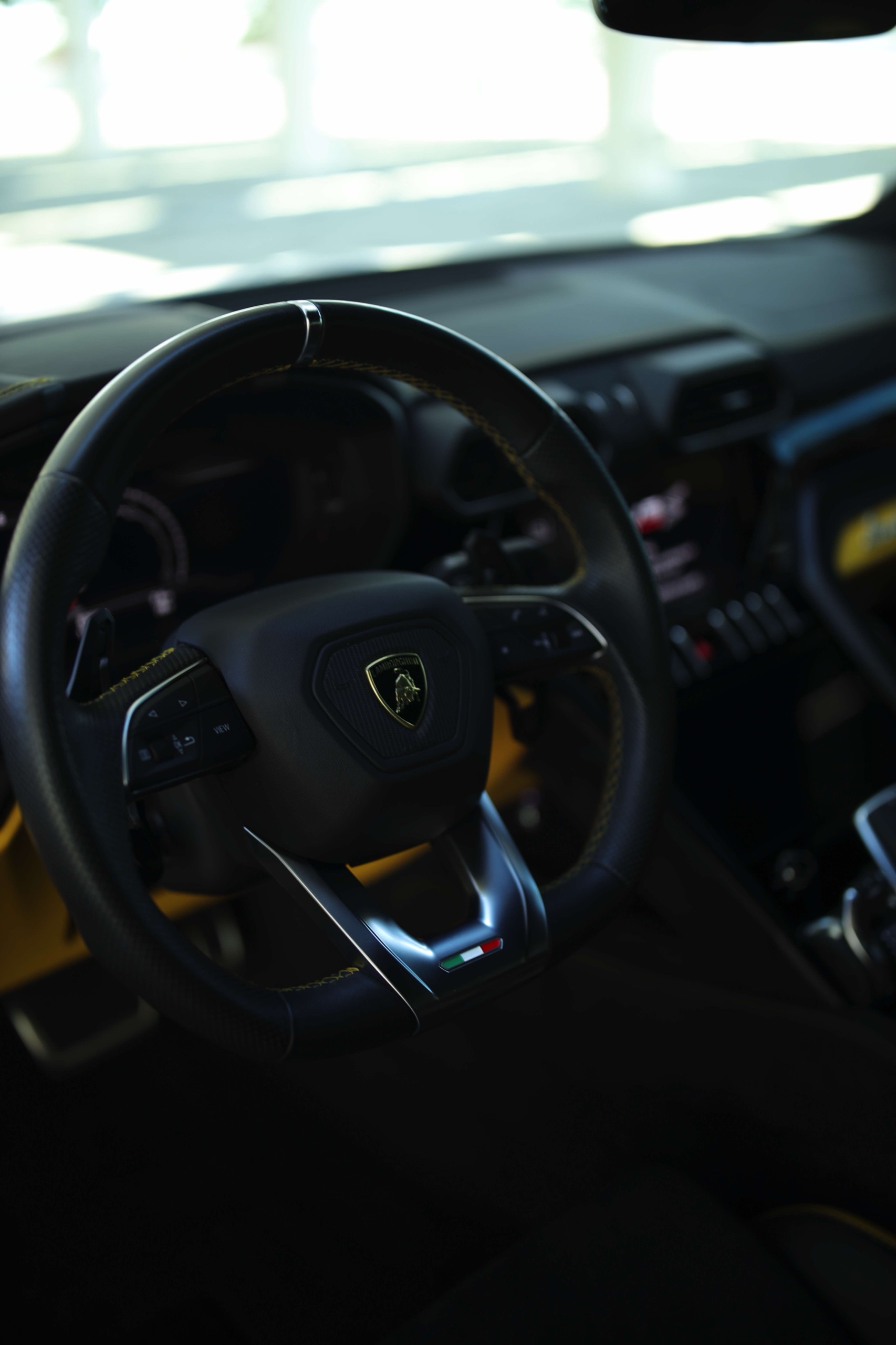 Lamborghini Urus S steering wheel and black cabin