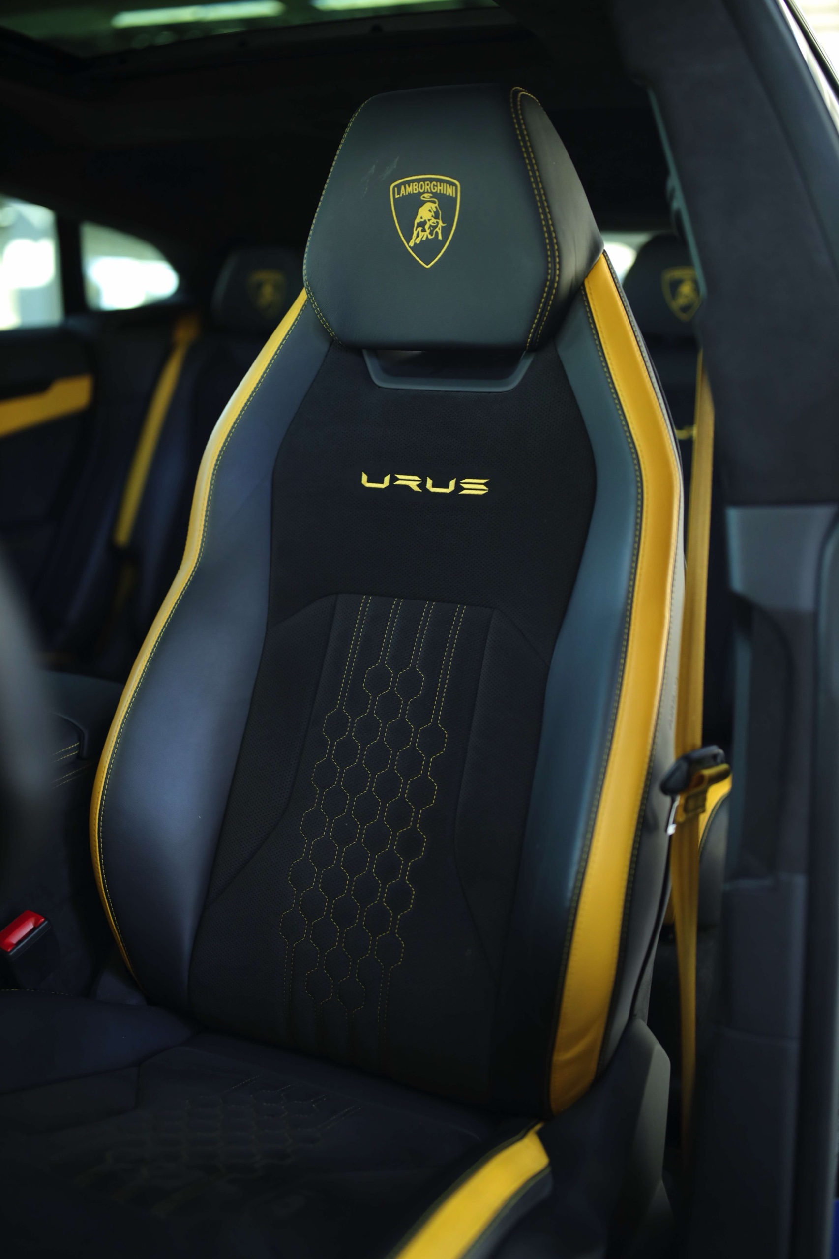Lamborghini Urus S front seat with black upholstery and yellow trim
