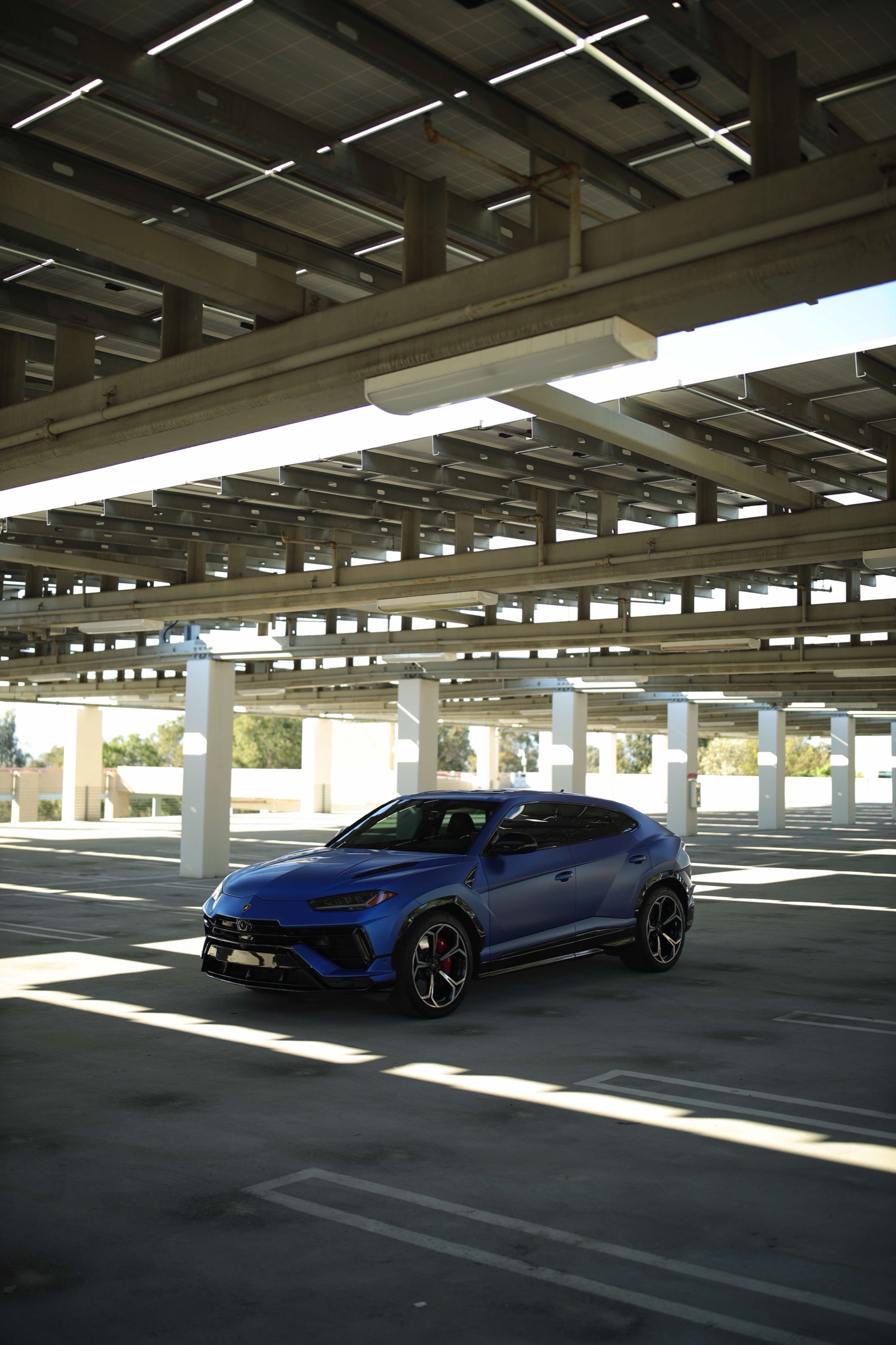 Full front three-quarter view of the Frozen Blue Lamborghini Urus S