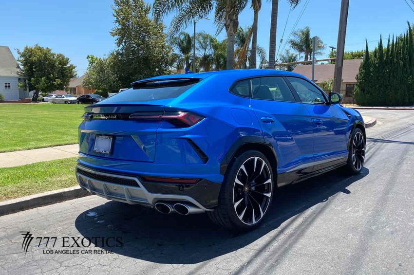 rear corner view of blue lamborghini urus