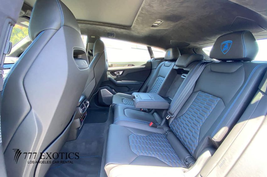rear passenger seat of blue lamborghini urus