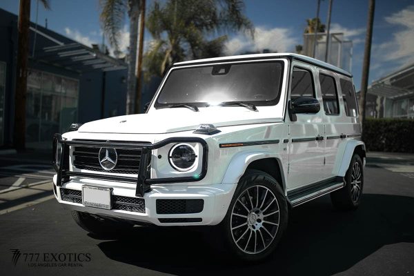 white mercedes benz g550 corner view