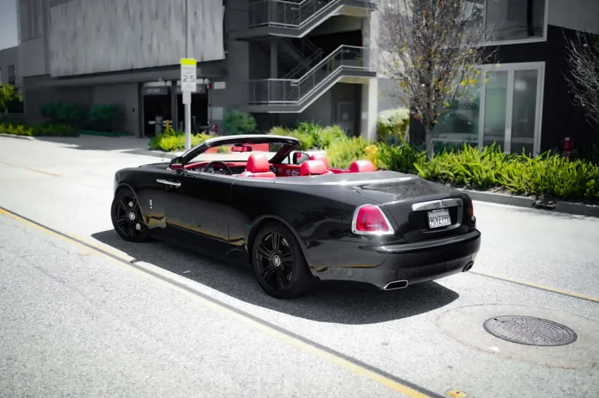 Rolls-Royce-Dawn-Black-Open-Top-Driving-Back-View
